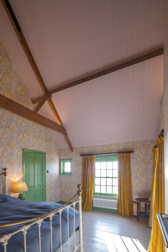High ceilinged bedroom